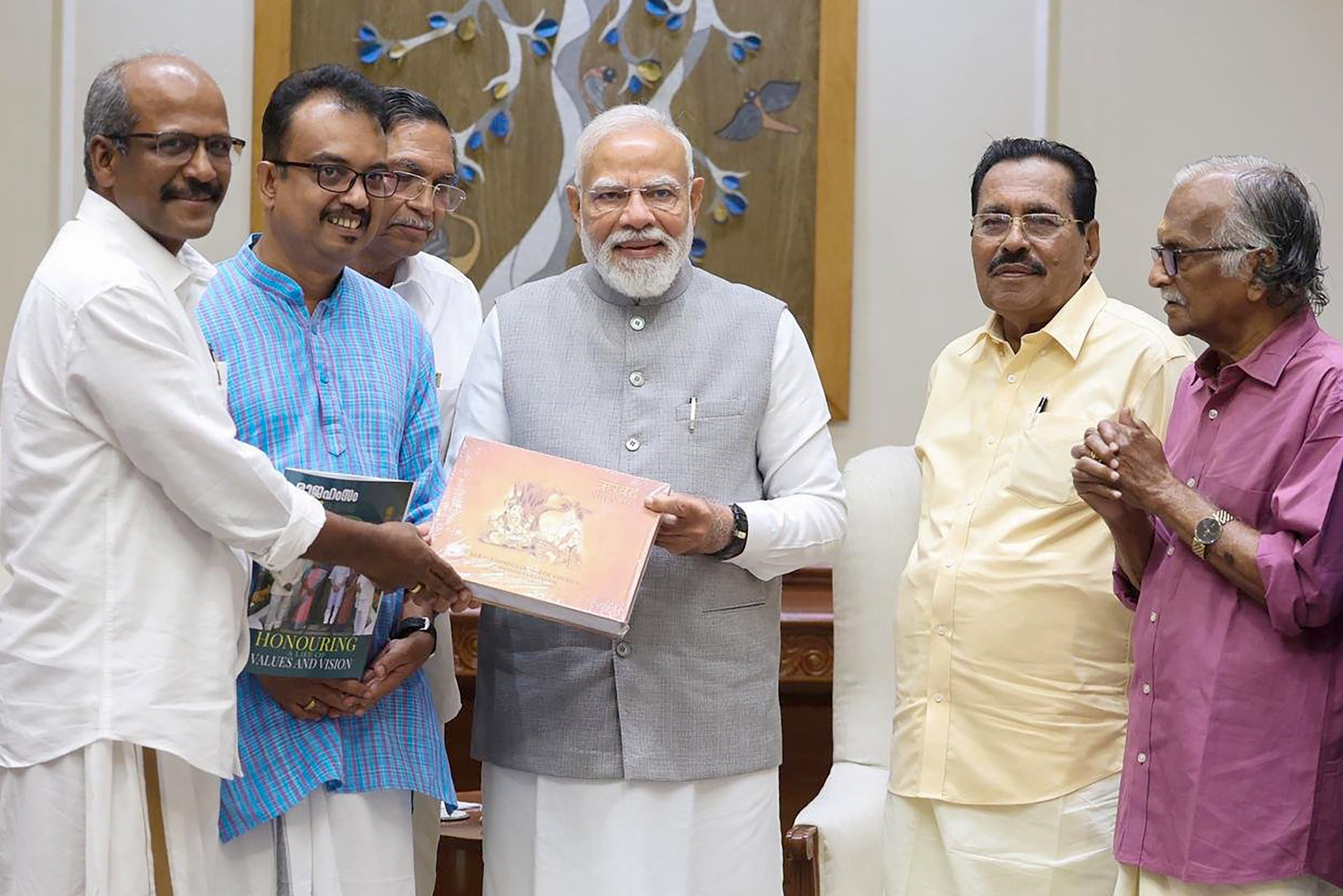 PM Modi receives group of eminent Malayali litterateurs in New Delhi