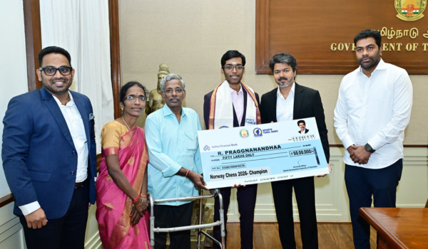 Tamil Nadu CM Vijay presents Rs 50 lakh cheque to Grandmaster Praggnanandhaa for Norway Chess title